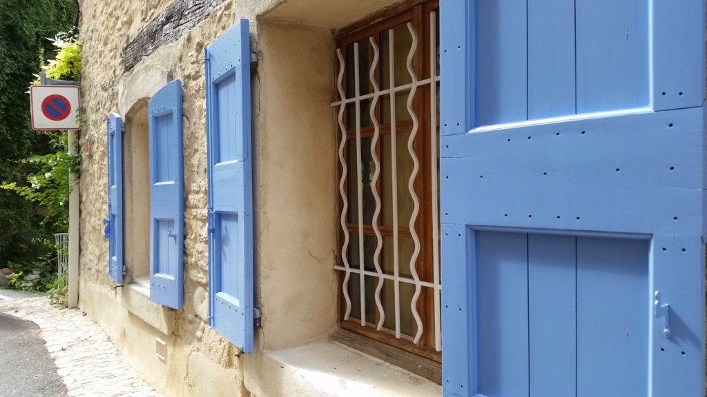 Blue window shutters in Aix-en-Provence, France